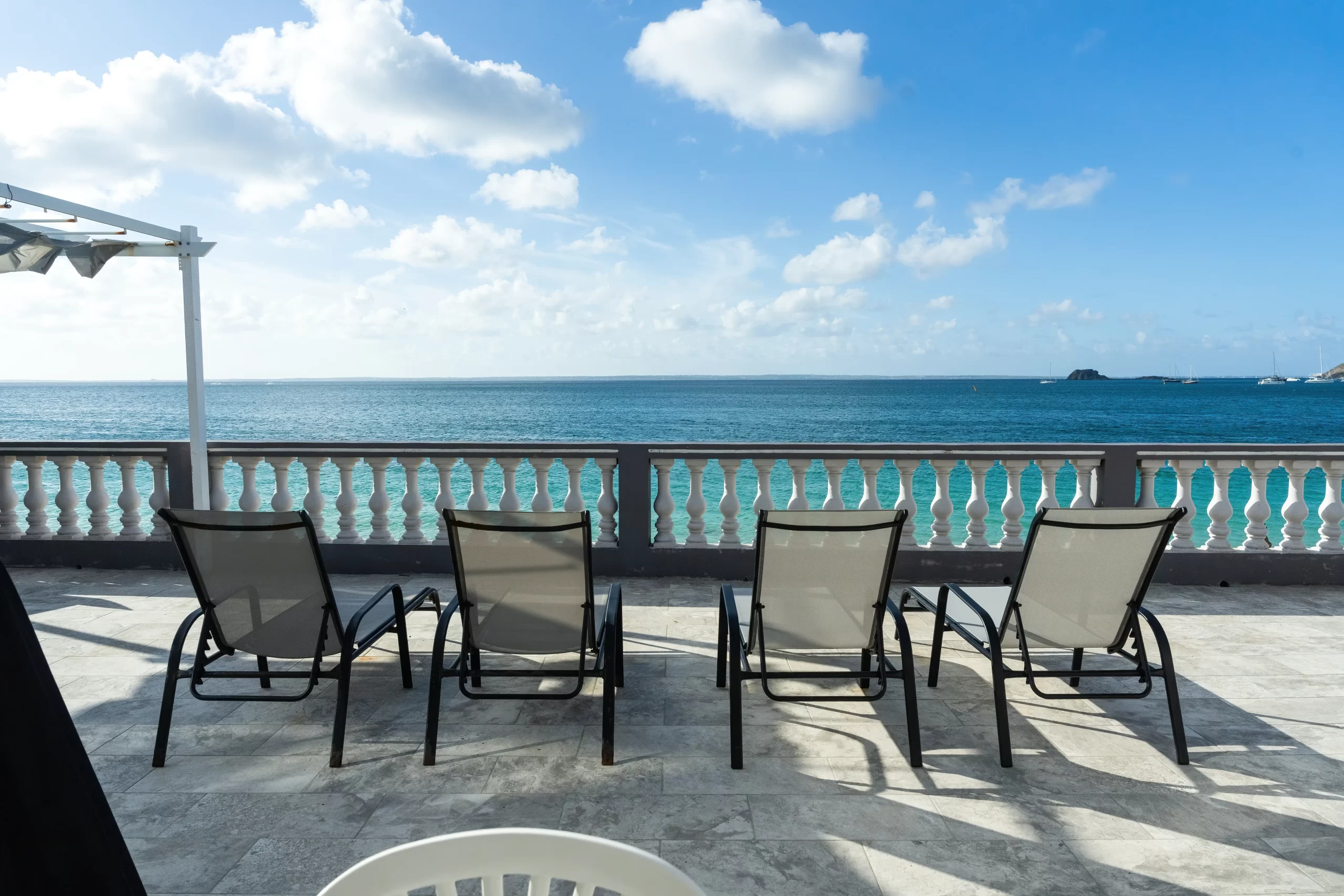 Caribbean Sea and outdoor loungers at Novels Villa