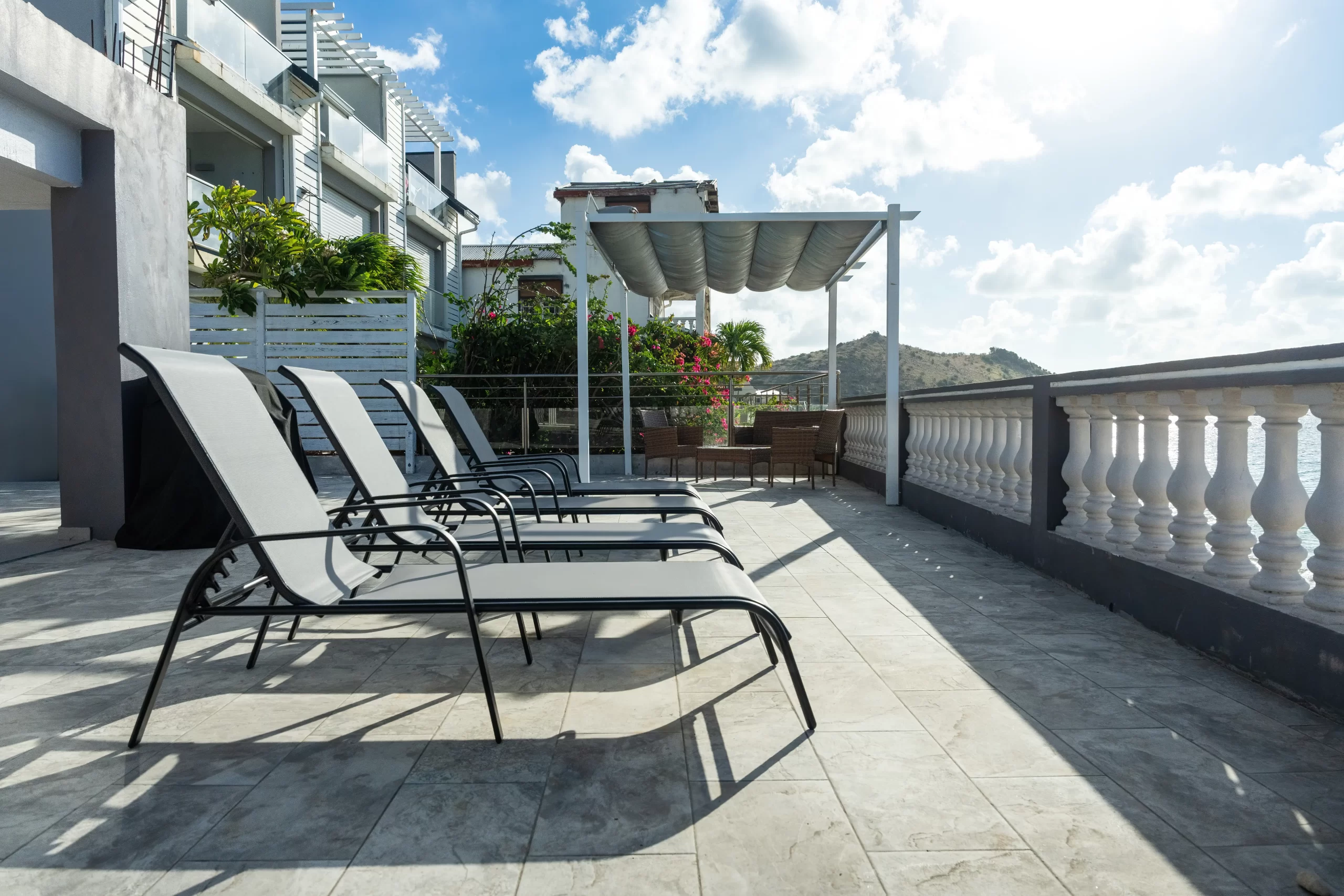 Sun loungers and terrace at Novels Villa in Grand Case
